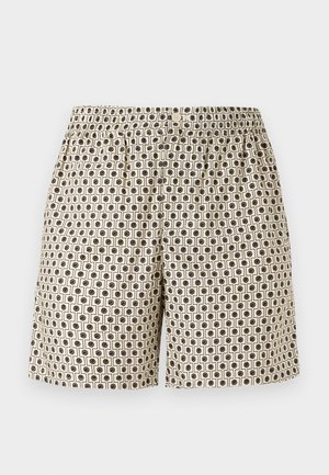 Pantalones cortos beige para hombre con patrón geométrico de cuadrados y círculos negros, cinturilla elástica y cierre frontal con botón.