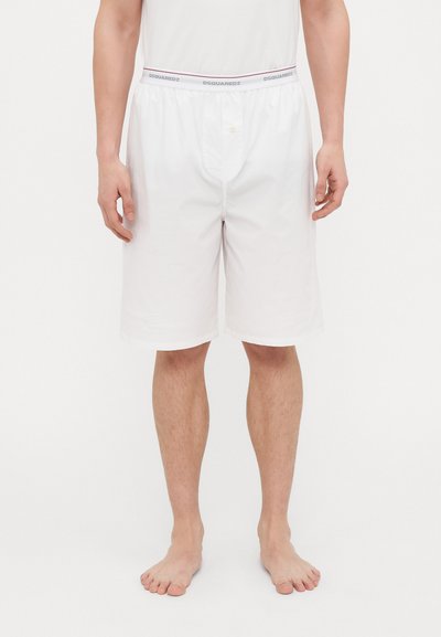 White shorts made of lightweight fabric, featuring a comfortable waistband with brand name and button detail at the front.