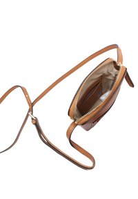 Small brown leather crossbody bag with gold zipper open to show beige fabric interior and card slots, resting on white background.