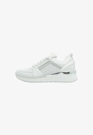 White sneaker with mesh upper, padded collar, and metallic accents. Features a chunky white sole, lace-up design, and branding on the side.