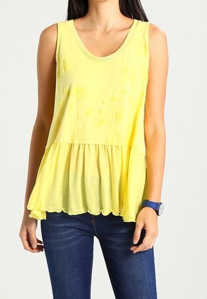 Yellow sleeveless top with a gathered peplum hem, featuring subtle floral embroidery and a scoop neckline, made from lightweight fabric.