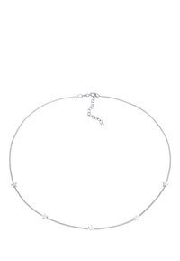 Silver chain necklace featuring small star accents along the length, with a lobster clasp and adjustable extender chain for length.
