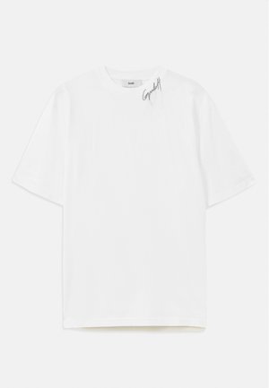 T-shirt bianca in cotone con colletto rotondo, maniche corte, orlo dritto e un sottile logo nero ricamato nella parte superiore sinistra.