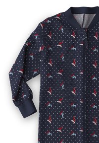Tutina blu navy realizzata in morbido tessuto, con un motivo ripetuto di renne e piccoli triangoli bianchi. Cerniera frontale e polsini a coste.