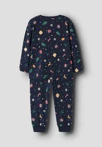 Ensemble de pyjama en coton bleu marine avec des motifs festifs, comprenant des arbres, des cadeaux, des cannes en sucre d'orge et des rennes. Haut à manches longues et pantalon élastiqué.