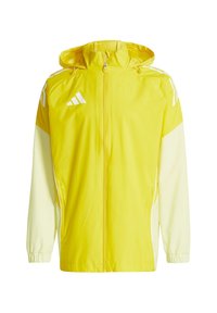 Veste légère jaune avec capuche, accents blancs et fermeture éclair. Dispose de poignets élastiques et de poches latérales. Conçue pour le port en extérieur.