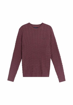 Bordowy sweter z dzianiny o splocie warkoczowym, z długimi rękawami, okrągłym dekoltem i ściągaczami. Posiada teksturowany wzór oraz małe haftowane logo na piersi.