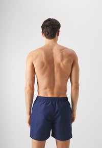 Calvin Klein Swimwear MEDIUM DRAWSTRING - Plaukimo šortai - signature navy