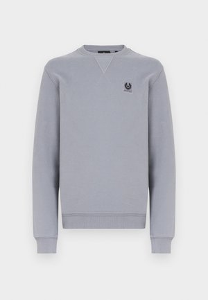 Harmaa collegepaita pehmeästä kankaasta, pyöreällä kaula-aukolla, pitkillä hihoilla ja pienellä logoplaasilla rinnassa. Resorit hihansuissa ja helmassa.