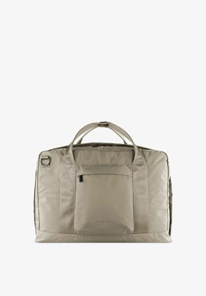 Grand sac en tissu beige avec double poignée, poche avant et branding discret. Texture douce avec une forme rectangulaire structurée.