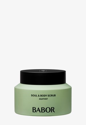 Babor Soul & Body Scrub Agathist dans un pot vert pâle avec un couvercle noir, avec un texte noir minimaliste au devant.