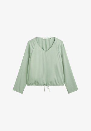 Light green long-sleeve blouse with a V-neck, fitted waistband with a tie detail, and smooth, lightweight fabric.