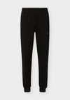 ATHLETIC - Tracksuit bottoms - black