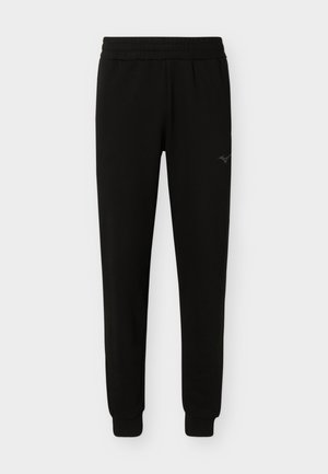 Pantaloni jogger neri slim-fit con fascia elastica in vita e polsini, con un piccolo logo sulla parte superiore della coscia.