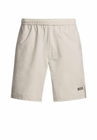 Bañador beige con cintura elástica, que presenta el logo "BOSS" en negro en la parte inferior derecha y franjas laterales en contraste.