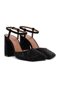 Scarpe nere con tacco a spillo e punta affusolata, decorate con scintillanti strass. Presentano un cinturino alla caviglia e un tacco a blocco texturizzato.