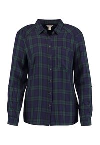 Chemise en flanelle avec un motif à carreaux bleu et vert, à manches longues, fermeture à bouton et poche poitrine. Texture douce et coupe droite.