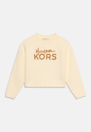 Kremowa, krótka bluza z długim rękawem z brązowym napisem logo "Michael Kors" z przodu na białym tle.