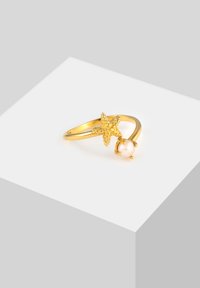 Goldring mit einem Seestern-Design und einer kleinen Perle. Der Ringkopf ist glatt mit einer polierten Oberfläche. Der Seestern hat eine strukturierte Ausarbeitung.
