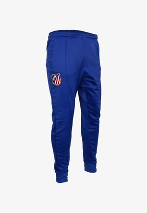 Blauwe sportbroek met elastische tailleband en het embleem van de voetbalclub Atlético Madrid op de rechterdij.