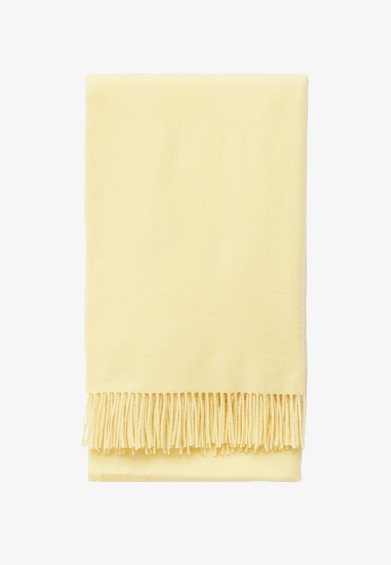 Yellow fleece throw blanket with fringed edges, soft texture, and rectangular shape, folded showing smooth surface and fringe detail.
