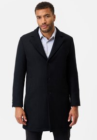 Black wool overcoat with notched lapels, single-breasted design, four buttons, and side pockets, tailored fit, smooth texture.