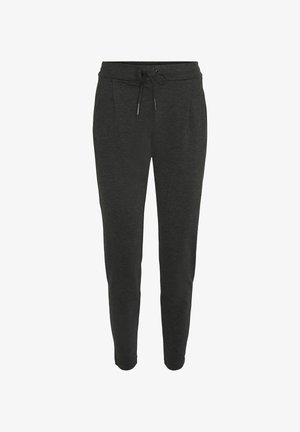 Tumed hallid dressipüksid, mis on valmistatud pehmest kangast, kummiga vöökoha ja kahe esikotiga, ning kitsenevad jalad, et saavutada istuv välimus.