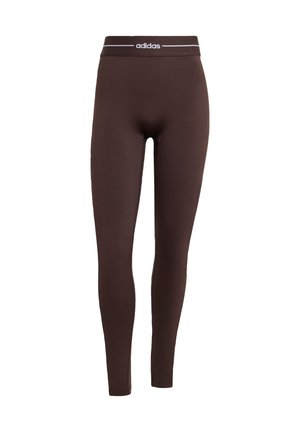 Bruine leggings gemaakt van rekbare stof met een elastische tailleband met een wit Adidas-logo. Strak model, gladde textuur, volledig lang.