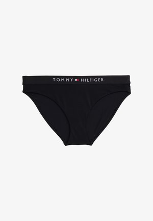 Črne bikini hlačke iz gladkega materiala. Imajo širok elastični pas z logotipom "TOMMY HILFIGER" v beli in rdeči barvi.