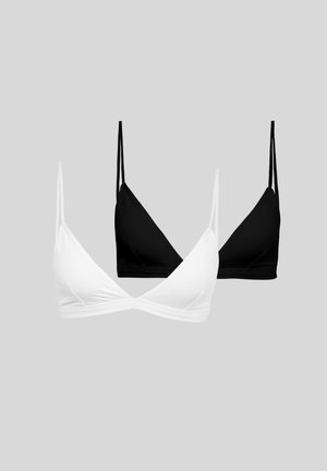 Due bralette con coppe a triangolo e spalline sottili, una bianca davanti e una nera dietro, esposte su uno sfondo grigio chiaro.