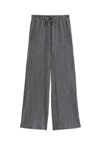 Pantaloni a gamba larga con vita regolabile, caratterizzati da strisce verticali alternate nere e bianche, distesi su uno sfondo bianco.