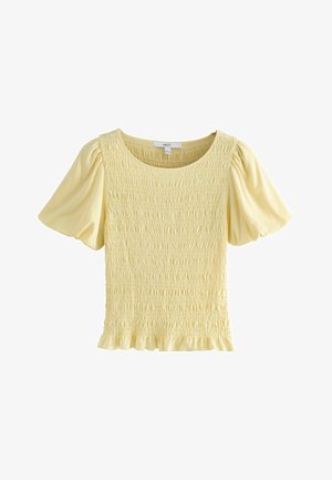 Gelbes Top mit geraffter Textur und kurzen Puffärmeln. Verfügt über einen runden Ausschnitt und einen Rüschensaum. Weiches Stofffinish.