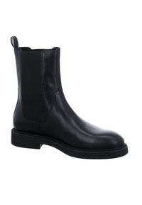 Botte Chelsea en cuir noir avec panneaux élastiques sur les côtés, bout arrondi, talon bas et languette à l'arrière.