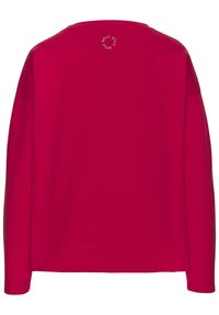 Camisa roja de manga larga con cuello redondo. Presenta un pequeño logo blanco de "SMILE" en la parte posterior. Fabricada con un material suave de mezcla de algodón.