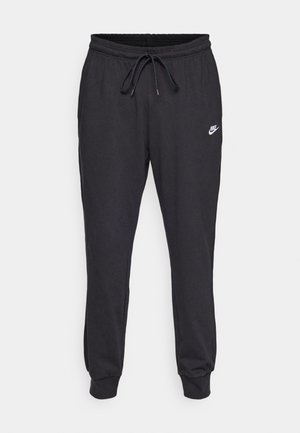 Svarta sweatpants i bomullsmix, med resårmidja och dragsko, mudd vid anklarna, och en vit Nike-logga på låret.