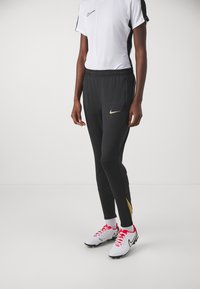 Nike Performance - STRIKE PANT - Tracksuit bottoms - black/jersey gold/metallic gold Thumbnail Image 1