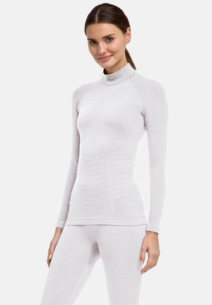 Lichtgrijs, langärmelig topje met een hoge kraag, met een aansluitend ontwerp en een textuurpatroon. Minimalistische merknaam op de borst.