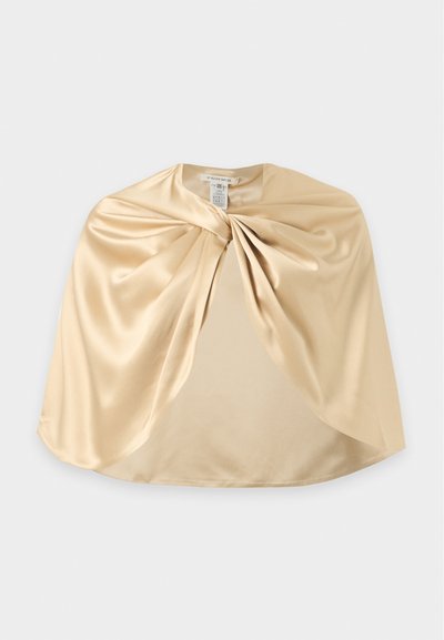 Cape en satin beige avec un détail froncé au niveau de l'encolure et une texture lisse et fluide, présentée à plat sur un fond clair.