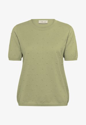Short-sleeve, round-neck green knit top with textured dot pattern, soft fabric, and slightly elastic hem. Label reads "CREAM."