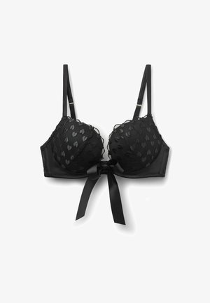 Sujetador de encaje negro con patrones de corazones, tirantes ajustables, copas acolchadas y un lazo de satén atado en el centro delantero.