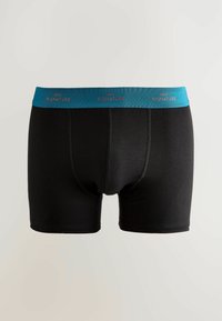 Boxeri negri pentru bărbați, cu un brâu teal pe care apare textul repetat "NEXT SIGNATURE" în culoarea cuprului.