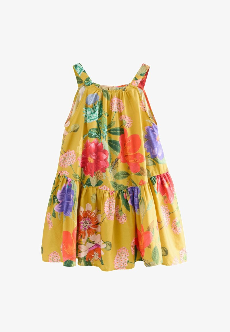 Ziedu kleita ar dzeltenu kokvilnas audumu, kas rotāta ar dzīvām sarkanu, rozā un zilu ziedu ilustrācijām, bez piedurknēm un ar vairākiem ruffles apakšmalā.