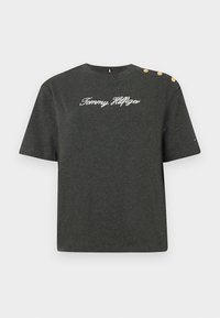 Dark grey short-sleeve t-shirt made of cotton with a round neckline, featuring white embroidered "Tommy Hilfiger" logo and three decorative gold buttons.