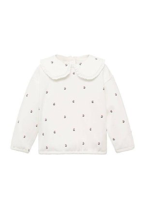 Haut blanc à manches longues avec un col à volants, parsemé de petites broderies florales en rose et marine. Tissu doux, coupe décontractée.