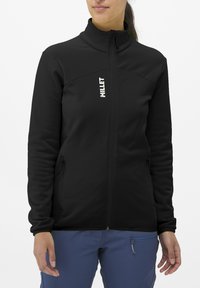 Black fleece jacket with high collar, front zipper, and two side pockets. Features logo in white on chest. Smooth texture and fitted design.