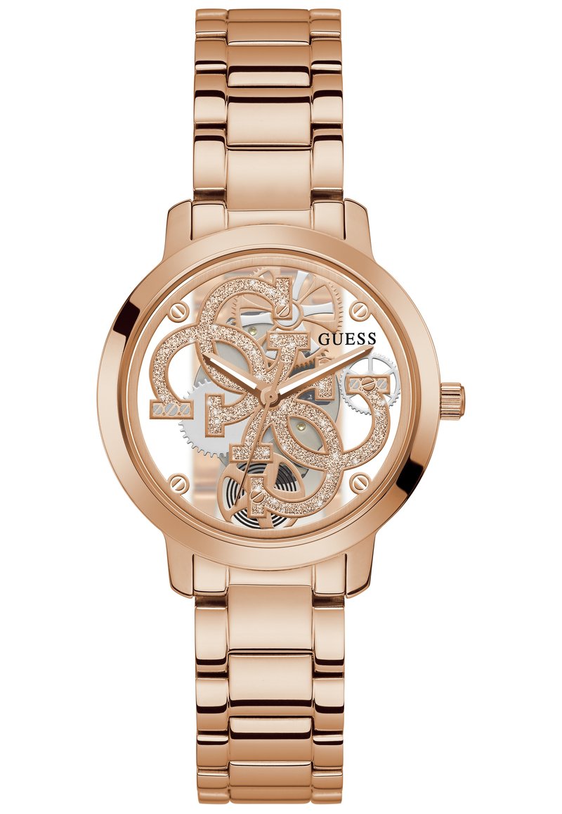 Orologio color oro rosa con un quadrante trasparente che presenta le iniziali del marchio intrecciate, accenti metallici lucidi e un bracciale di metallo a maglie.