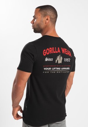 Black short-sleeve t-shirt featuring red and white graphic text on the back, made of lightweight fabric, designed for sports and lifting.