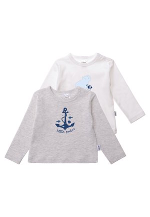 Two long-sleeve shirts: one white with a blue animal graphic, the other gray with a blue anchor design and text "little sailor." Soft fabric.