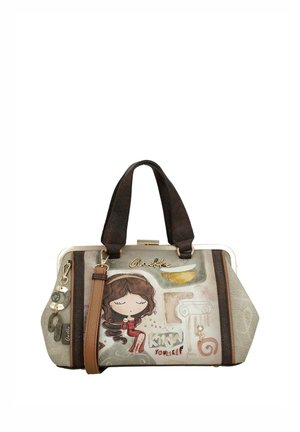 Bolso con asas dobles de color marrón oscuro, correa marrón claro e ilustración de una niña con los ojos cerrados y el texto "conócete a ti mismo".