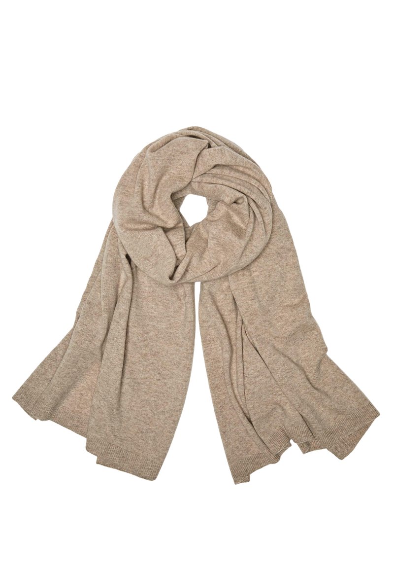 Écharpe tricotée beige avec une texture douce, présentant un design en torsade circulaire. Les extrémités sont frangées, ajoutant un détail subtil.